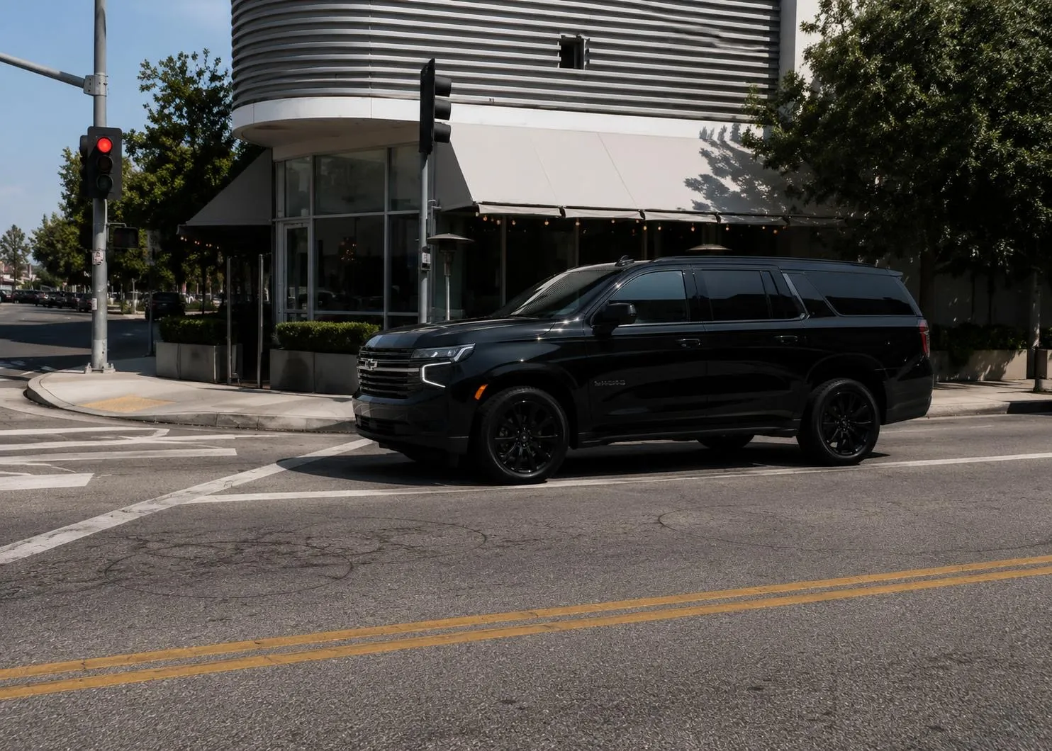 Black BuluRide luxury SUV on a Southern California street during an hourly chauffeur charter
